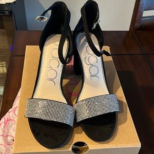 Black suede 3 1/4 block heel. Very comfortable ankle strap adjustable. Size 7